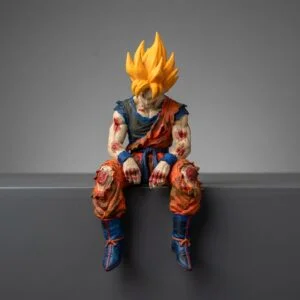 Sad Goku Figurine Sitting on a ledge! product image 1